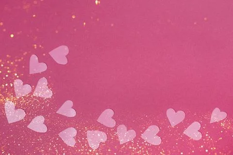 Herts with sequins on a pink background. Stock Photos