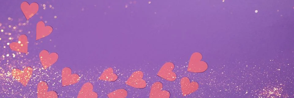 Herts with sequins on a violet background. Stock Photos
