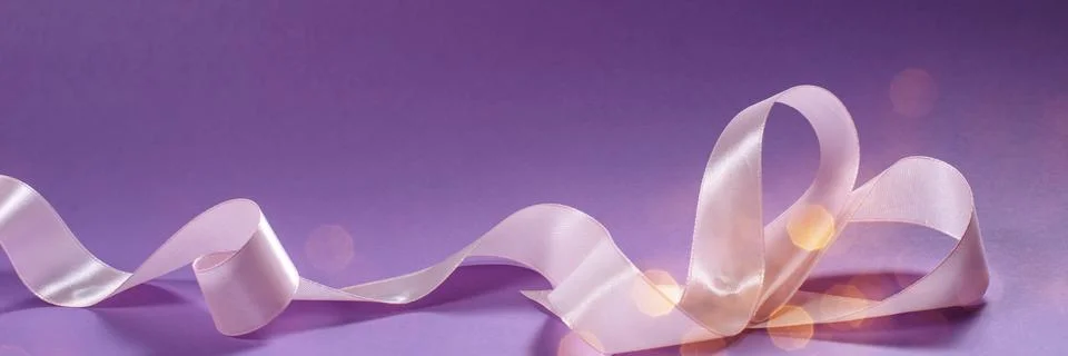 Herts with sequins on a violet background. Stock Photos