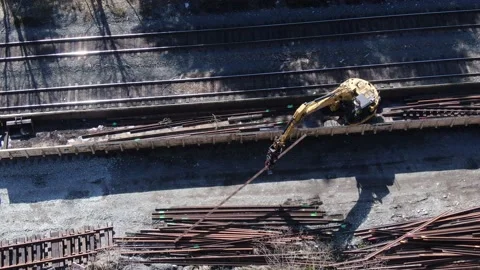 Herzog rail machine offloading rail Stock Footage 149145948