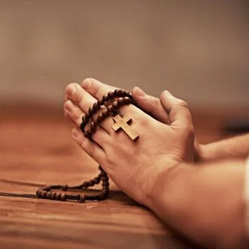 Hes always there to answer your prayers. Cropped shot of a man holding a rosary Stock Photos