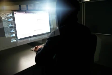 Hes caught up in the code. Rearview shot of an unrecognizable male computer 写真素材