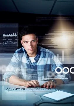 Hes deep into the code. a handsome young male programmer at work. 스톡 사진