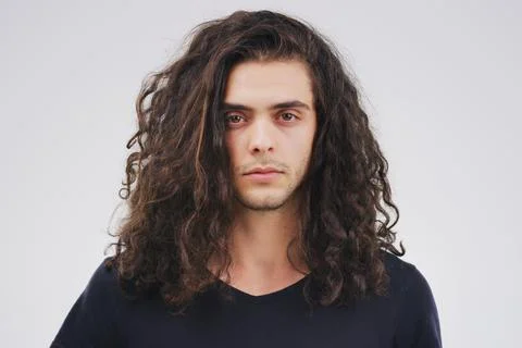 Hes difficult to read. Studio portrait of a handsome young man posing Stock Photos