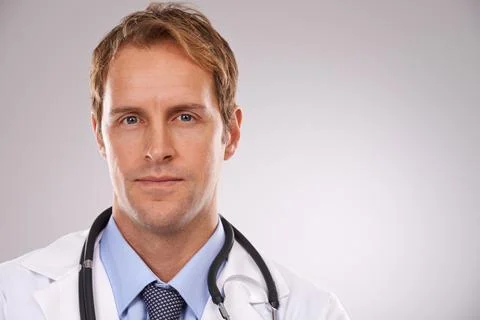 Hes a fantastic physician. Cropped studio portrait of a confident young male Stock Photos