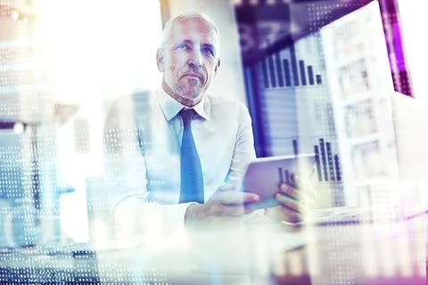 Hes full of ideas for coding. a mature businessman working on programming code. Stock Photos