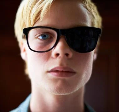 Hes got a biased view of things. Attractive young guy wearing hipster glasses Stock Photos