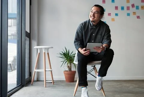 Hes got a winning plan in mind. Full length shot of a creative young businessman Stock Photos