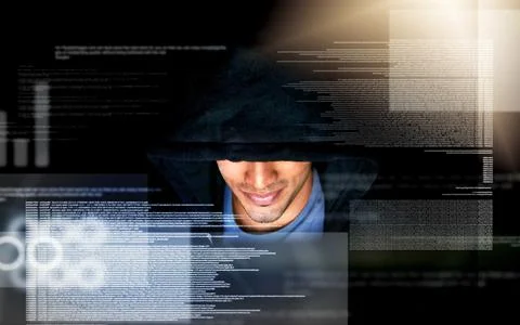 Hes making progress on his new code. a handsome young male computer programmer Stock Photos