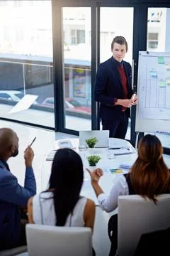 Hes ready to answer every question thrown at him. a young businessman giving a Stock Photos