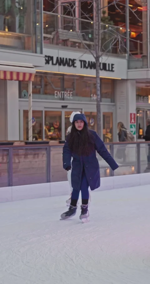 Hesitant First-Time Skater Testing The Ice At Esplanade Tranquille Stock Footage 334156426