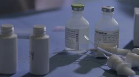 Hesitant scientist with needle Stock Footage 20446364