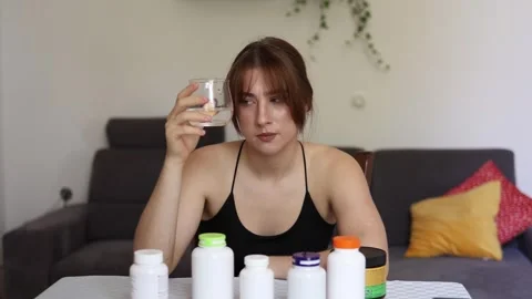 Hesitating before taking pills. Video stock 339096558
