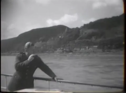 HESSE, GERMANY - 1945: River watcher - Passenger watches a riverside village 库存影片 343849233
