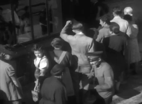 HESSE, GERMANY - 1946: Shopfront queue - Civilians stand packed in a long line Stock Footage 344486005