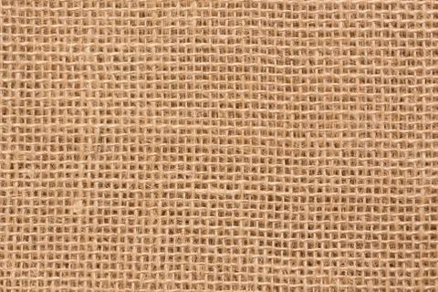 Hessian sackcloth woven texture pattern background in light crea Stock Photos