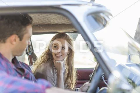 Heterosexual Couple In Car Together, Smiling