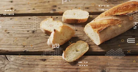 Hex grid icons fading over sliced baguette on wooden tabletop, pulsing, shifting Stock Footage 314473513