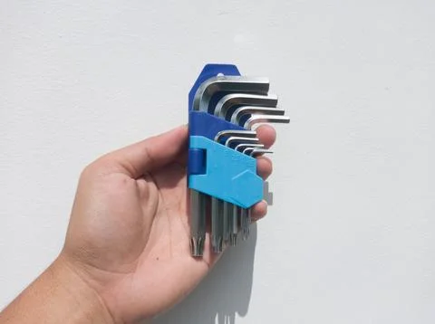 Hex key set in hand 스톡 사진