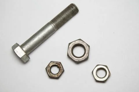Hex nuts and bolt on white background Stock Photos