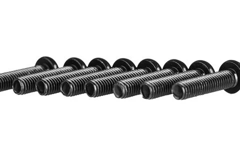 Hex socket head screw in black color on isolated white background Stock Photos