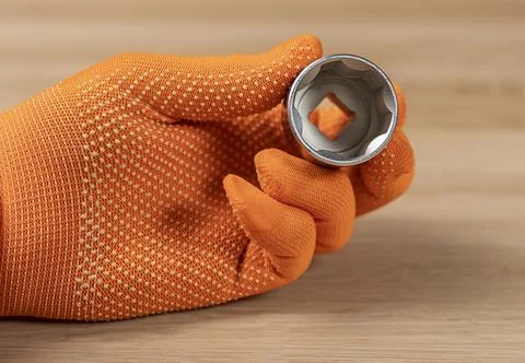 Hex socket, hexagon metal head for building tool in male hand Stock Photos
