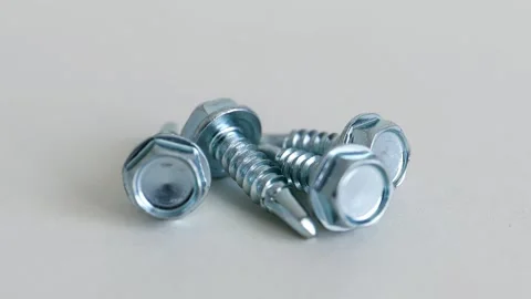 Hex Washer Head Self Drilling Screws on White Background Close Up Stock Footage 333773750