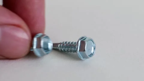 Hex Washer Head Self Drilling Screws on White Background Close Up Stock Footage 333773798
