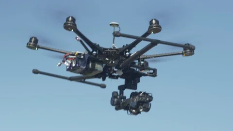 Hexacopter drone lifting off and hovering. 4K Stock Footage 86665245