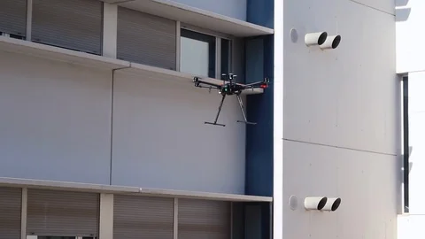 Hexacopter drone performing a fully automatic GPS-assisted landing. Stock Footage 119110129