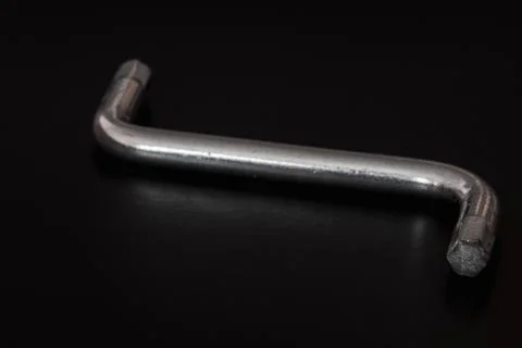 Hexagon socket screw allen key in a black background isolated Stock Photos