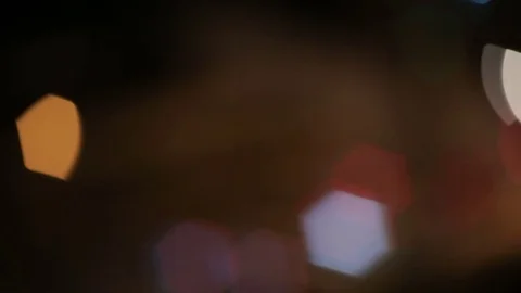 Hexagonal bokeh nighttime urban traffic Stock Footage 73528158