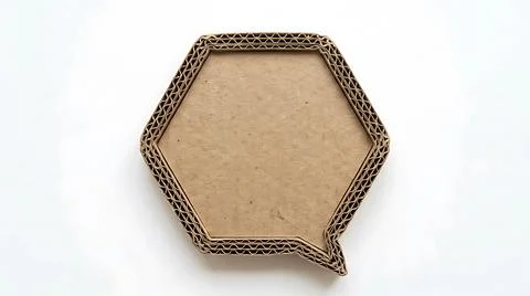 Hexagonal cardboard speech bubble cutout isolated on a clean white background Stock Photos
