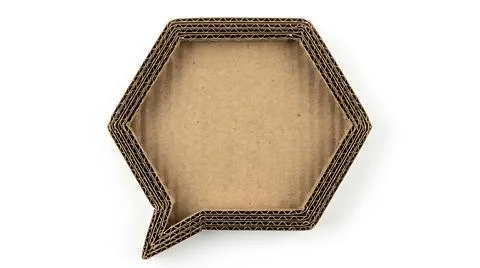 Hexagonal cardboard speech bubble cutout isolated on a clean white background Stock Photos