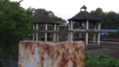 Hexagonal concrete shelters within an elevated ritual platform looking down towa Stock-Footage 342477425
