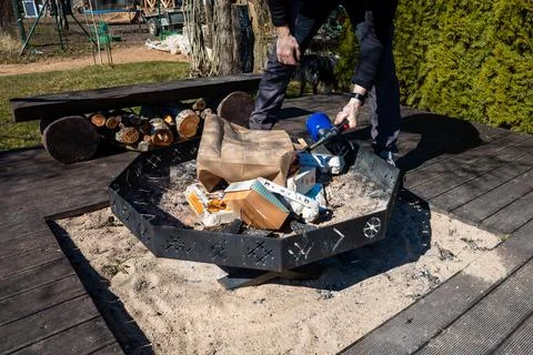 Hexagonal Fire Pit on Sandy Base with Firewood and Outdoor Tools Stock Photos