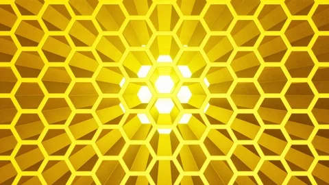 Hexagonal gold honeycomb with bright volume light. Vertical movement camera.  Video stock 100431730