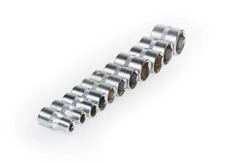 Hexagonal interchangeable sockets set on light surface in selective focus 스톡 사진