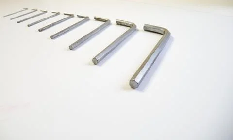 Hexagonal key on a white background. Copy space. 스톡 사진