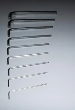 Hexagonal key on a white background. Copy space. Stock Photos