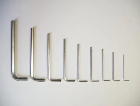 Hexagonal key on a white background. Copy space. Stock Photos