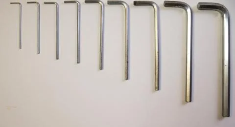 Hexagonal key on a white background. Copy space. Stock Photos