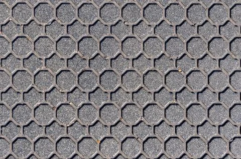 Hexagonal patterned manhole cover background Stock Photos