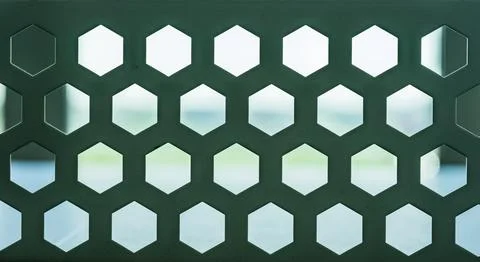 Hexagonal perforated panel with geometric pattern Foto stock