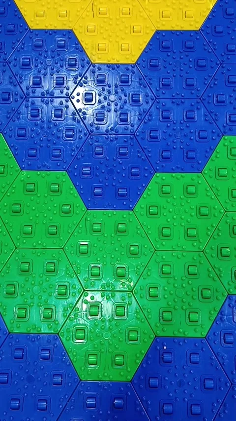Hexagonal plastic tiles ideal for creating a durable and colorful sports court s Video stock 335076258