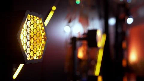 Hexagonal stage lighting glowing with a warm yellow color Stock Photos