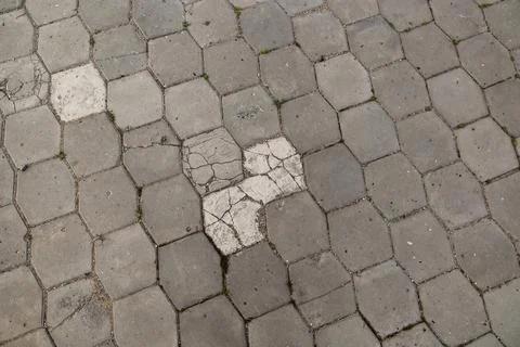 Hexagonal stone paving stones texture with cracks Stock Photos