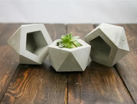Hexagonal stone pot for flowers. Stock Photos