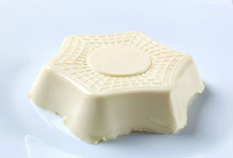 Hexagonal white soap bar with decorative pattern Stock Photos