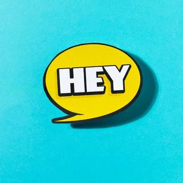 Hey text yellow speech bubble blue background Stock Photos
